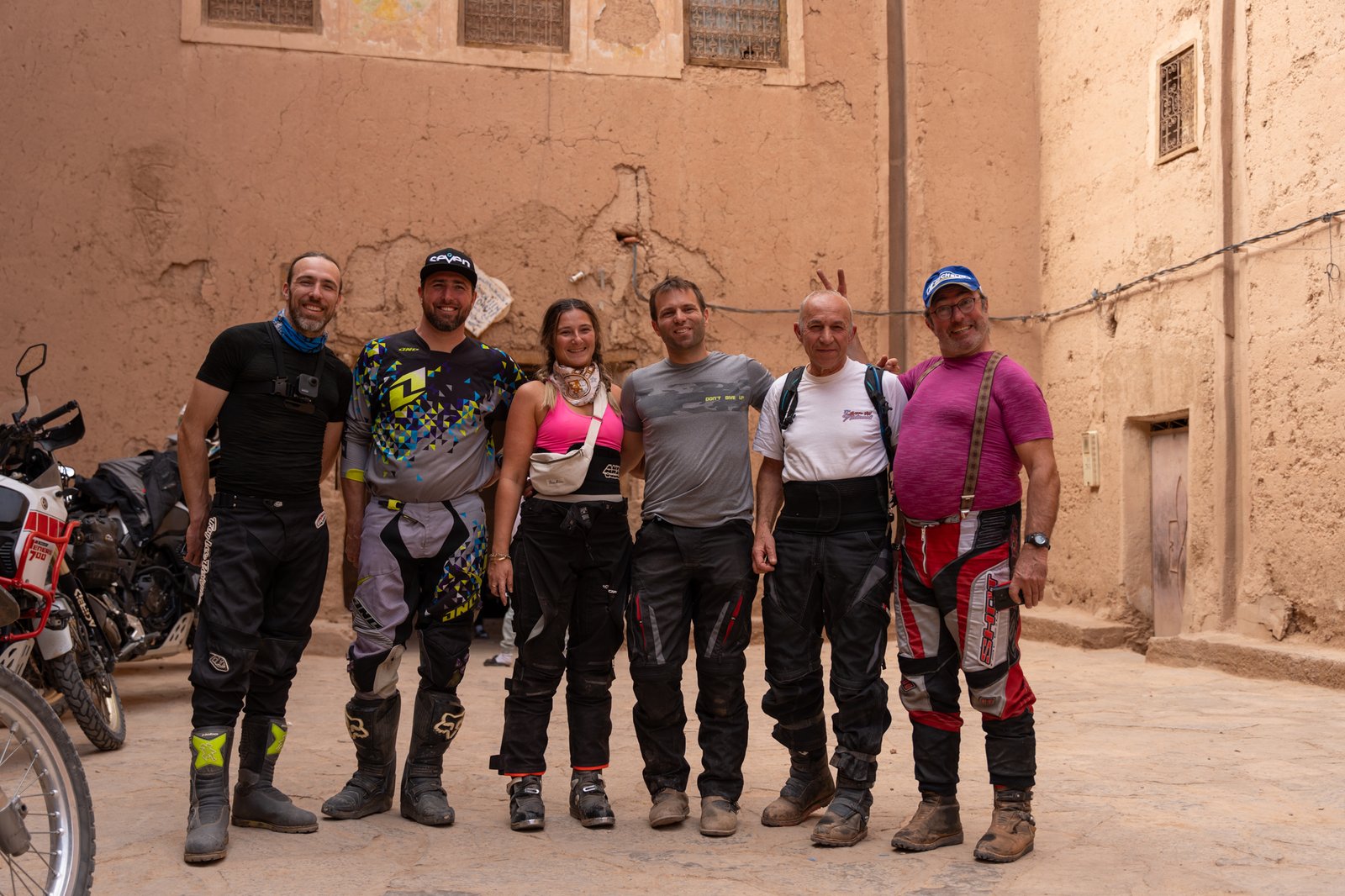 Keni Rides team at a garage in Morocco