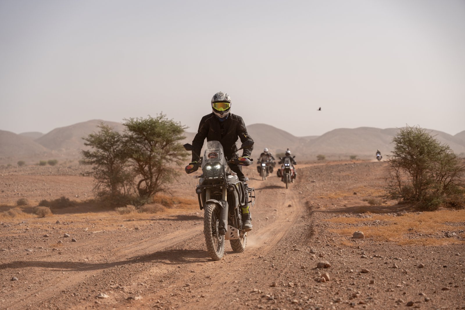 Motorcycle riding a dusty mountain trail in Morocco